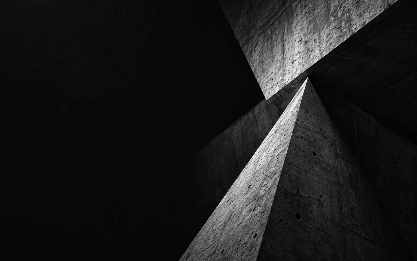 Struct agency template preview: dark angular concrete planes on a black ground.
